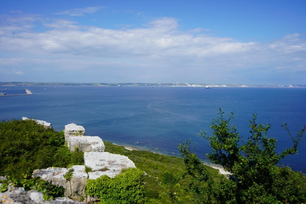 A picture from a hill on the coast overlooking the ocean