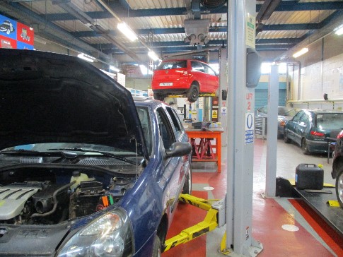 A vehicle workshop at Stocken showing cars that are being worked on