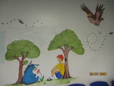 Photograph of a wall mural, a scene from Winnie the Pooh.