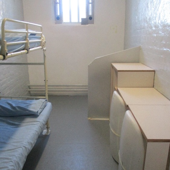 Photograph showing repaired flooring in good condition in a cell during this review visit.