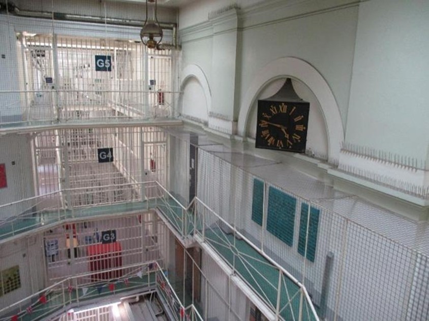 Photograph of the interior of Pentonville prison, showing a hub with wing spurs leading off it.
