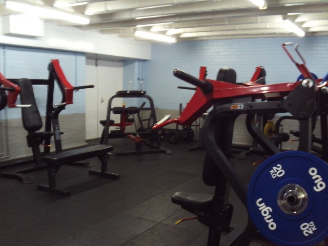 Photograph of an area of the gym in which weights machines can be seen.