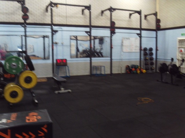 Photograph of the gym, with fitness equipment visible.