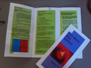 Photograph of a cell call bell awareness leaflet. the leaflet is shown in folded and unfolded form. It is in green, red and blue colours, with black font.