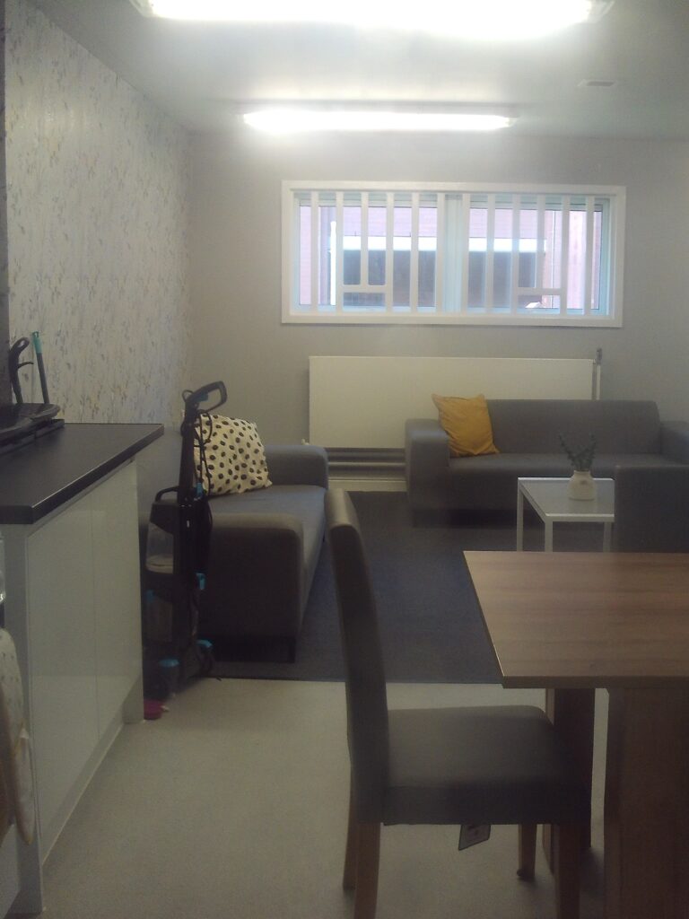 Photo of care leavers flat, with the kitchen and dining area in the foreground