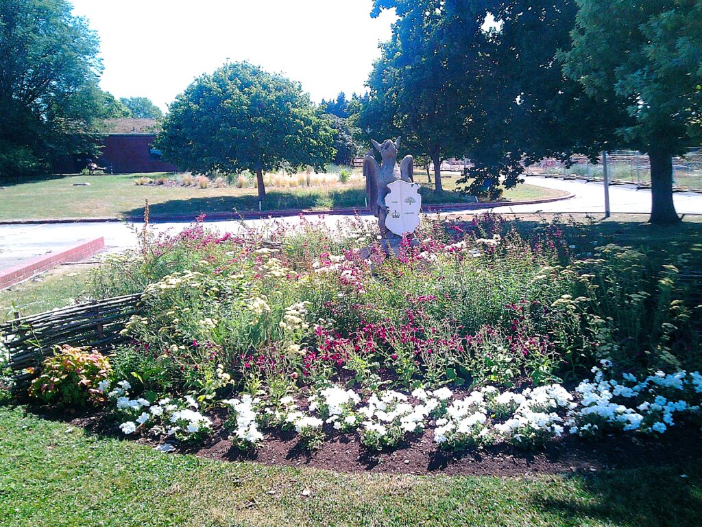 Photograph of a large flower bed in the grounds.