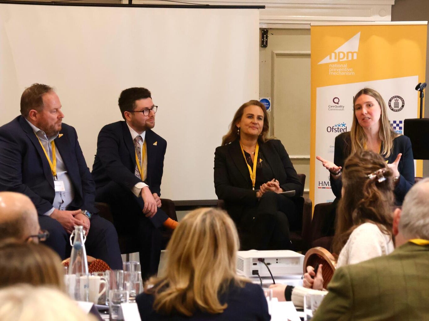 Panellists on stage answering audience questions.