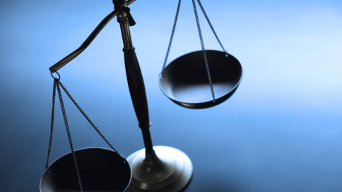 Scales of Justice on a desk.