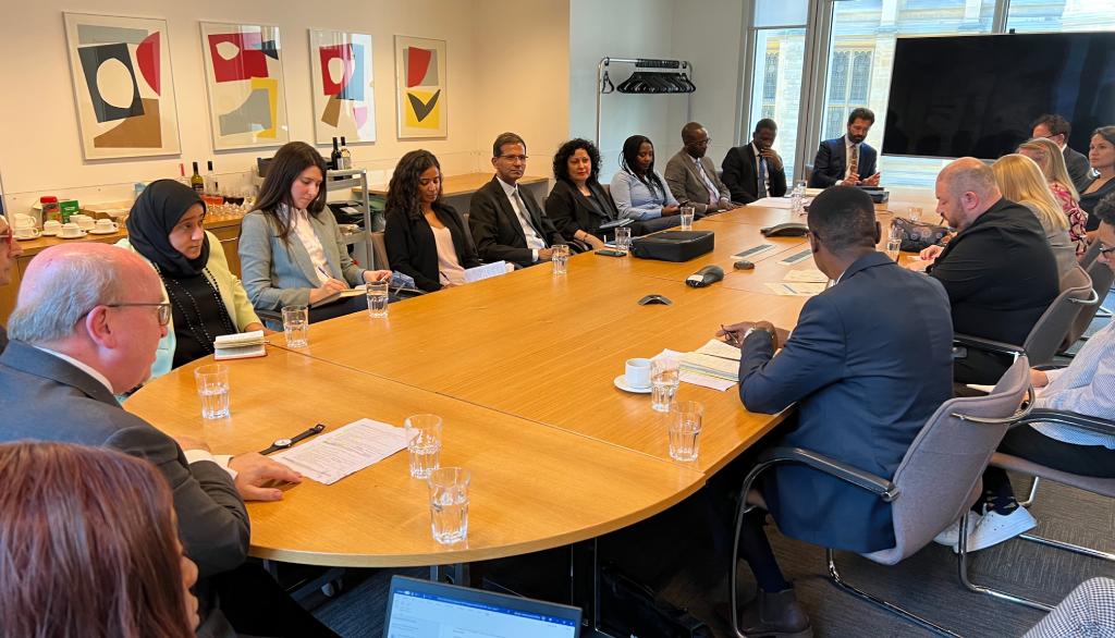 Judges from the 2023 Observation programme sat around a conference table with leading professionals and experts