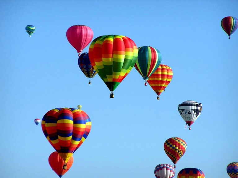 Stock image of several colourful hot air balloons in the sky