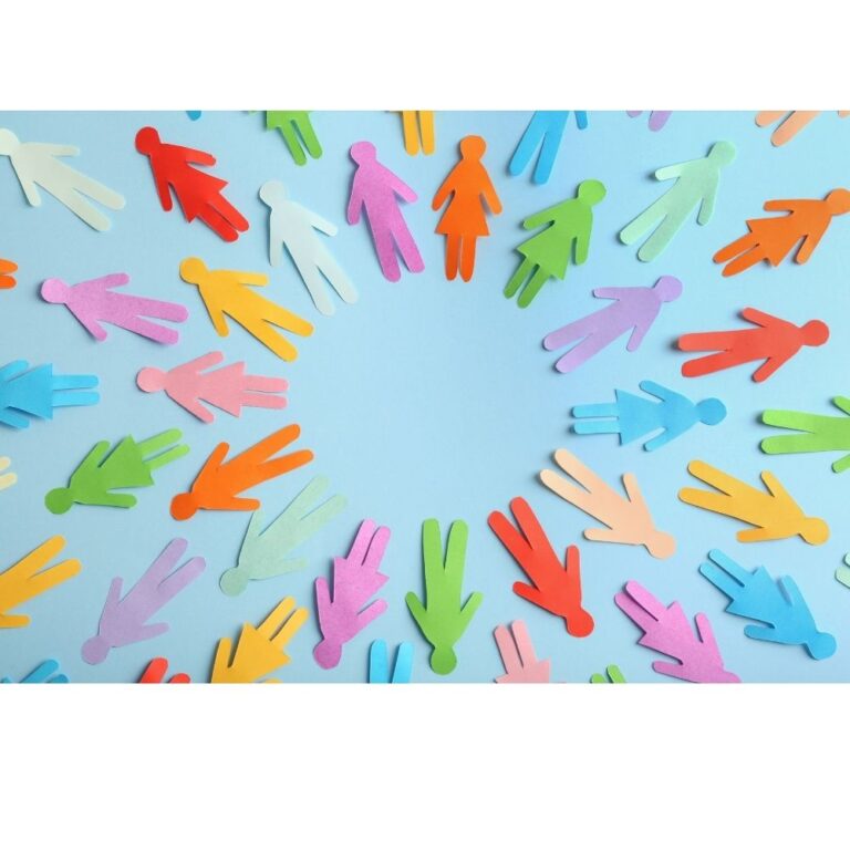 Image of lots of paper cut outs in the shape of a person