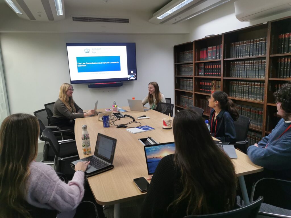Interns sitting at a conference table