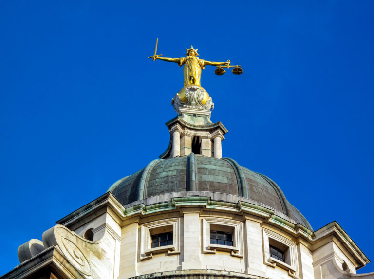 Photo of the Old Bailey statue of justice.