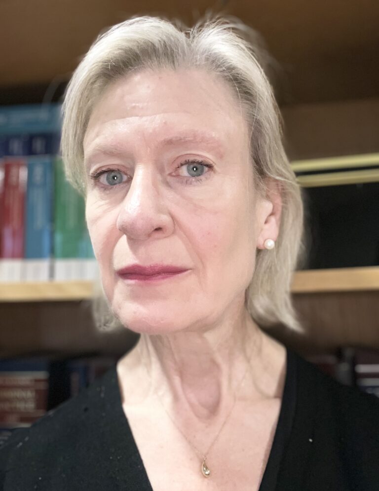 A headshot photograph of a woman.